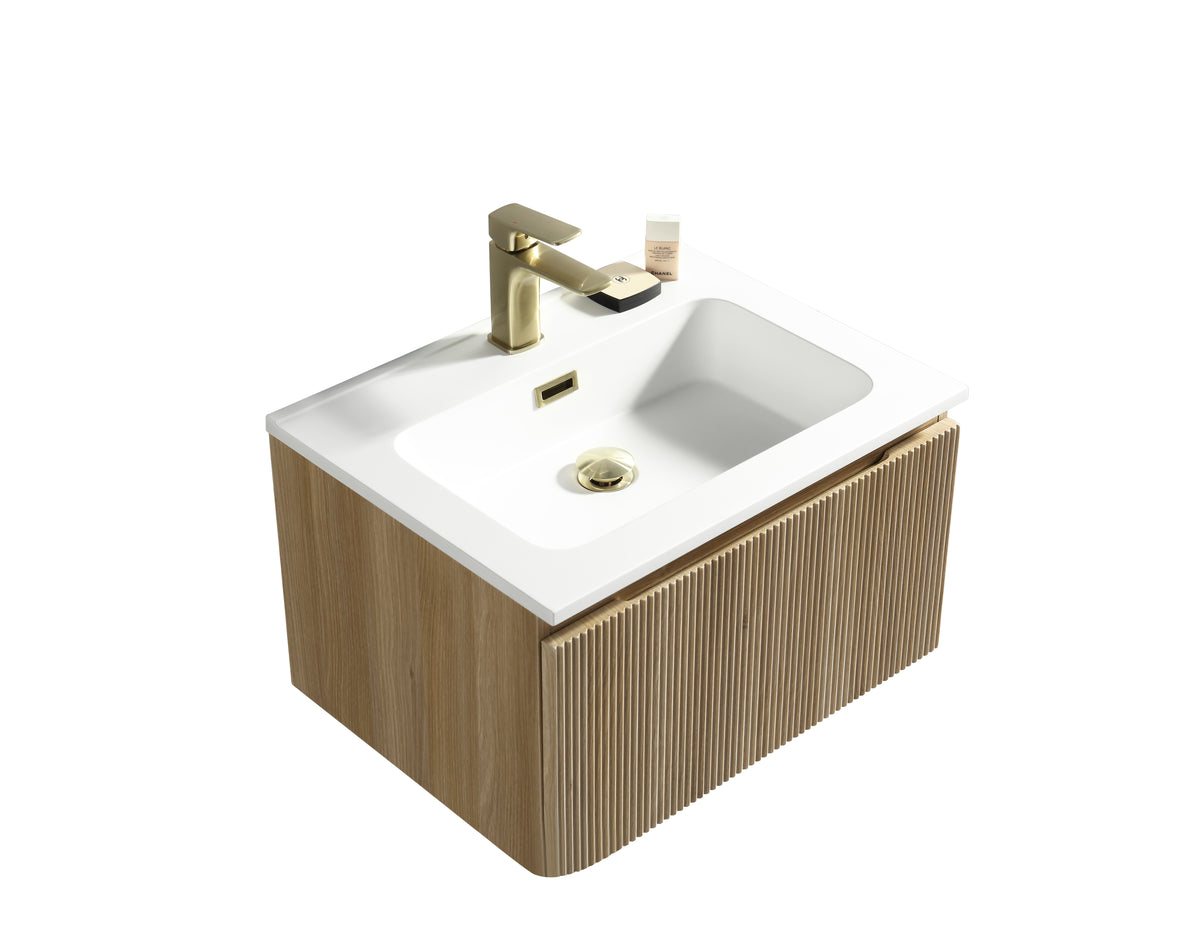 Bathroom sink with wooden cabinet and gold faucet on a white background