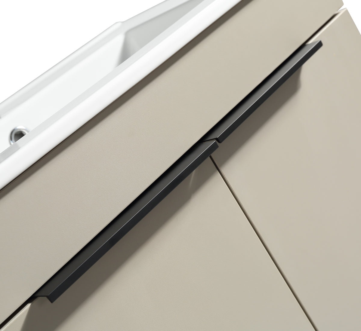 Close-up of a beige kitchen cabinet with a black handle on a white background