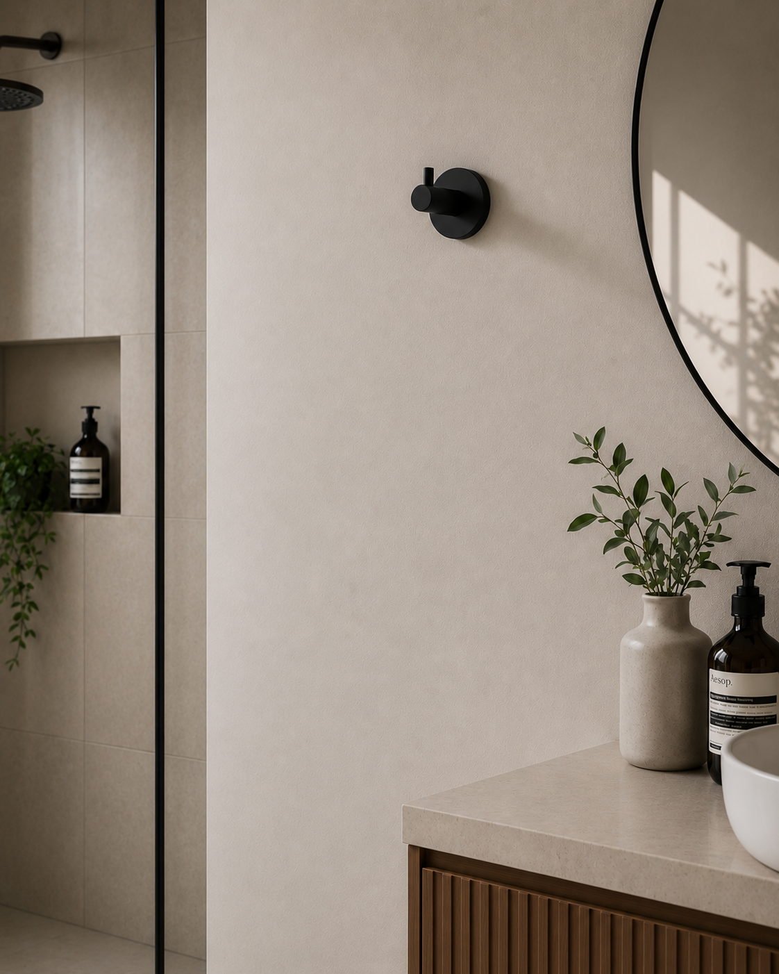 Modern bathroom interior with a mirror, countertop, and decorative items.
