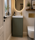 Bathroom interior with a sink, mirror, and toilet.
