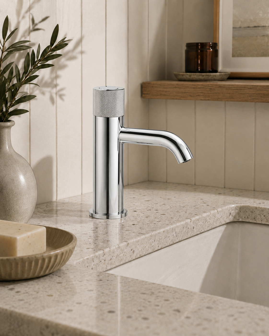 Bathroom sink with a modern faucet in a neutral-toned bathroom setting.
